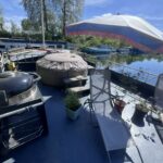 Freycinet barge 38.97 m BONANZA (1957) – deck with hot tub, barbecue and parasol