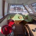 Kim Marine trawler Le Feeling (1977) – cockpit bench seat and red bar stools