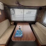 Locaboat 935 canal cruiser Kerplouf (1986) – saloon with table and convertible settees