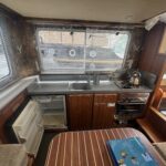Locaboat 935 canal cruiser Kerplouf (1986) – galley with sink, hob, oven and fridge