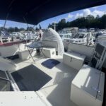Fairline 36 motor yacht Stella (1989) – aft deck lounge with table and lockers