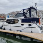 Noblesse 38 Dutch motor yacht ANATOLE (1998) – exterior view at pontoon, closed canopy