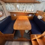 Smelne 1140 Dutch motor cruiser Dreamflower (1985) – U-shaped dinette in the forward saloon