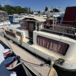 Locaboat 930 canal cruiser Sérénité (1981) – stern view from the pontoon, aft deck and wheelhouse
