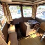 Locaboat 930 canal cruiser Sérénité (1981) – inside wheelhouse with wooden steering wheel