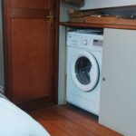 Dutch Hagenaar barge 18 m ANNA (1911) – laundry corner with washing machine near the cabin