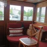 Dutch Hagenaar barge 18 m ANNA (1911) – wheelhouse bench seat and canal view