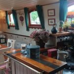 Dutch Hagenaar barge 18 m ANNA (1911) – dining area of the saloon next to the galley