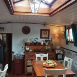 Dutch Hagenaar barge 18 m ANNA (1911) – dining area under the deck skylight