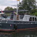 Bronsveen Kotter 1480 Dutch motor yacht Petit Michou (2002) – port side view at the quay