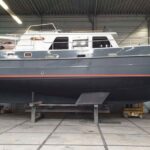 Bronsveen Kotter 1480 Dutch motor yacht Petit Michou (2002) – hull ashore in the shed