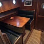 Bronsveen Kotter 1480 Dutch motor yacht Petit Michou (2002) – lower saloon dinette with leather seats