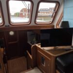 Bronsveen Kotter 1480 Dutch motor yacht Petit Michou (2002) – saloon TV corner and sink unit