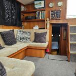 Aquanaut 11 m Dutch motor cruiser Aldebaran (1994) – saloon with corner sofa