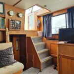 Aquanaut 11 m Dutch motor cruiser Aldebaran (1994) – saloon and steps to wheelhouse