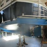 Smelne 1140 Dutch motor cruiser Dreamflower (1985) – steel hull ashore in the boat shed
