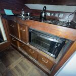 Dutch Tjalk sailing barge Osseo (1890) – galley with sink, gas hob and microwave