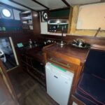 Dutch Tjalk sailing barge Osseo (1890) – galley with sink, cooker and refrigerator