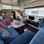 Connoisseur 1135 river cruiser Ingrine (1986) – saloon with dinette and TV