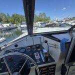 Connoisseur 1135 river cruiser Ingrine (1986) – wheelhouse and view over the marina