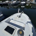 Connoisseur 1135 river cruiser Ingrine (1986) – foredeck with windlass and ensign