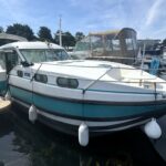 Nicols 1100 river cruiser Lodève (1998) – exterior bow quarter view at the pontoon