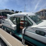 Nicols 1100 river cruiser Lodève (1998) – side view at the pontoon, saloon door
