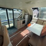 Nicols 1100 river cruiser Lodève (1998) – saloon, galley and aft deck access