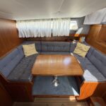 Van Vliet Atico 38 motor cruiser Joanne (1994) – saloon with U-shaped settee and table