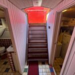 Dutch Luxe-Motor barge Dulcinea (1929) – companionway stairs between toilet and laundry room