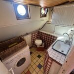 Dutch Luxe-Motor barge Dulcinea (1929) – washroom with toilet, tiled sink and washing machine