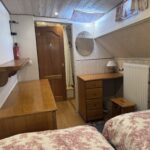 Dutch Luxe-Motor barge Dulcinea (1929) – twin cabin with chest of drawers, dressing table and wooden door