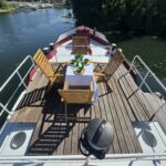 Dutch Luxe-Motor barge Dulcinea (1929) – wooden bow terrace with dining table and barbecue