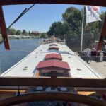 Dutch Luxe-Motor barge Dulcinea (1929) – view from the wheelhouse over the roof with red-canopied skylights