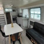 Vetus 1200 Damier Dutch motor cruiser (1992) – saloon dining area with settee and open galley