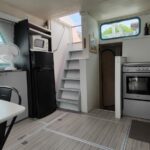Vetus 1200 Damier Dutch motor cruiser (1992) – galley and stairs leading to the upper deck