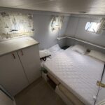 Vetus 1200 Damier Dutch motor cruiser (1992) – cabin with double bed and storage