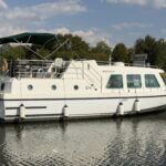 Vetus 1200 Damier Dutch motor cruiser (1992) – overall view at the quay with sun awning up