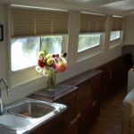 Dutch Luxe-Motor barge 14.50 m (1928) – galley with stainless steel sink and canal view