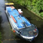 Residential barge 19.46 m (1905) – exterior view cruising on a canal