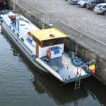 Residential barge 19.46 m (1905) – stern view at the quay with wheelhouse
