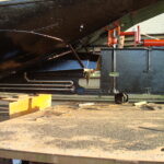 Residential barge 19.46 m (1905) – rudder and underside of the hull in dry dock