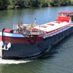 Dutch Luxe-Motor barge Dulcinea (1929) – aerial view underway, bow and sun deck