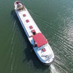 Dutch Luxe-Motor barge Dulcinea (1929) – aerial top-down view of the barge underway, stern in the foreground
