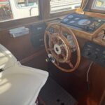 Schouten Muiden trawler Tibo (1978) – wooden wheelhouse, wheel and helm seat