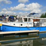 Schouten Muiden trawler Tibo (1978) – port side exterior view at the dock