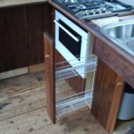 Dutch Luxe-Motor barge 14.50 m (1928) – galley detail: oven, steel sink and pull-out storage