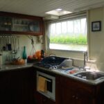 Dutch Luxe-Motor barge 14.50 m (1928) – galley with gas hob, oven and water view