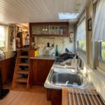 Dutch Luxe-Motor barge 14.50 m (1928) – galley with double sink and steps to the wheelhouse